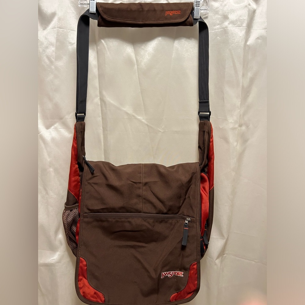 Jansport brown and orange crossbody laptop bags with many pockets.